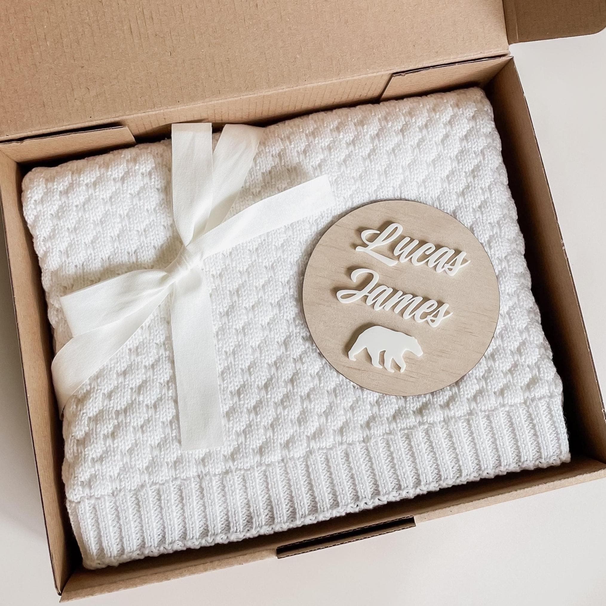 Baby Gift Set presented in a gift box. Includes personalised wooden announcement sign and soft cotton knit baby blanket. Blanket is available in two gender neutral colours of Milk or Oatmeal. Ideal gift for a newborn baby.